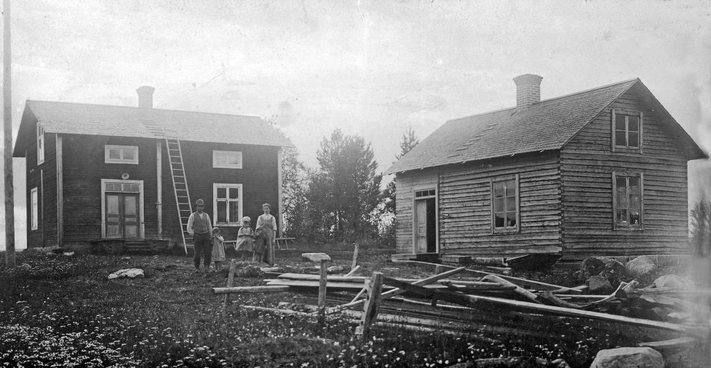 Gammalt fotografi på två hus